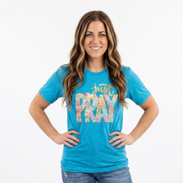 Woman wearing a blue t-shirt with 'Just Pray' text on a white background