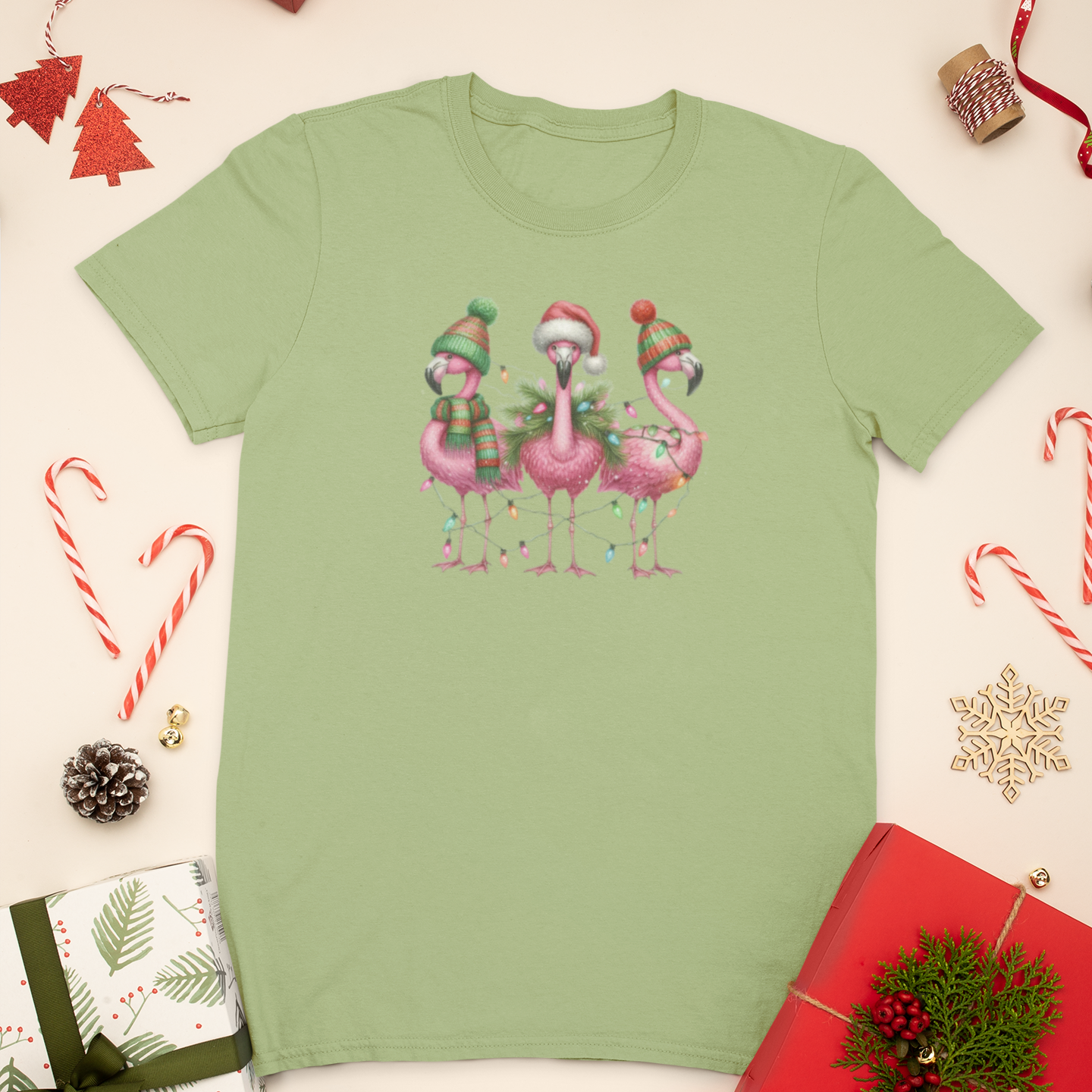 Green t-shirt with Christmas flamingo design on a festive background