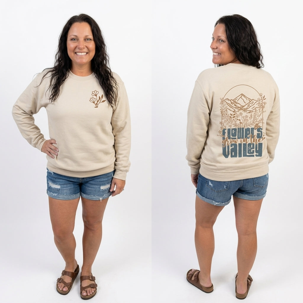 Woman wearing a beige sweatshirt with a design on the front and back, standing against a white background.