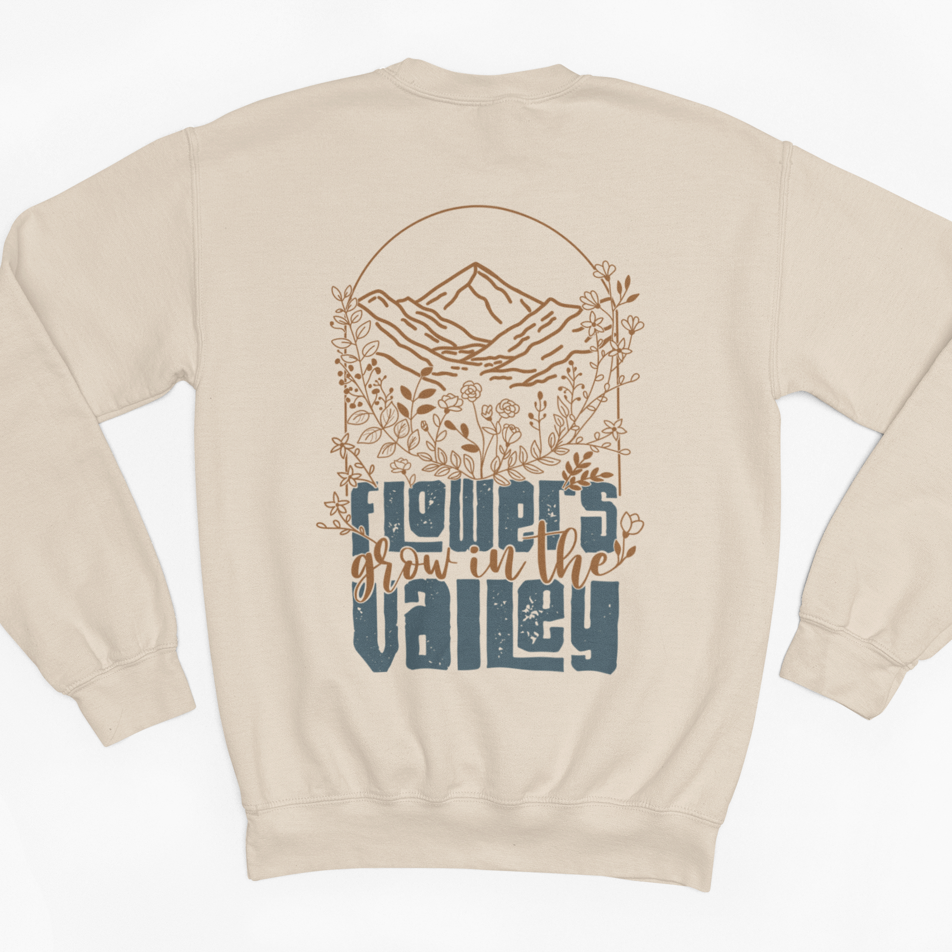 Beige sweatshirt with nature-themed design on a white background