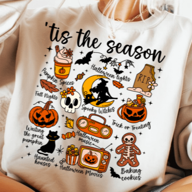 White sweatshirt with Halloween-themed graphics and text on a neutral background