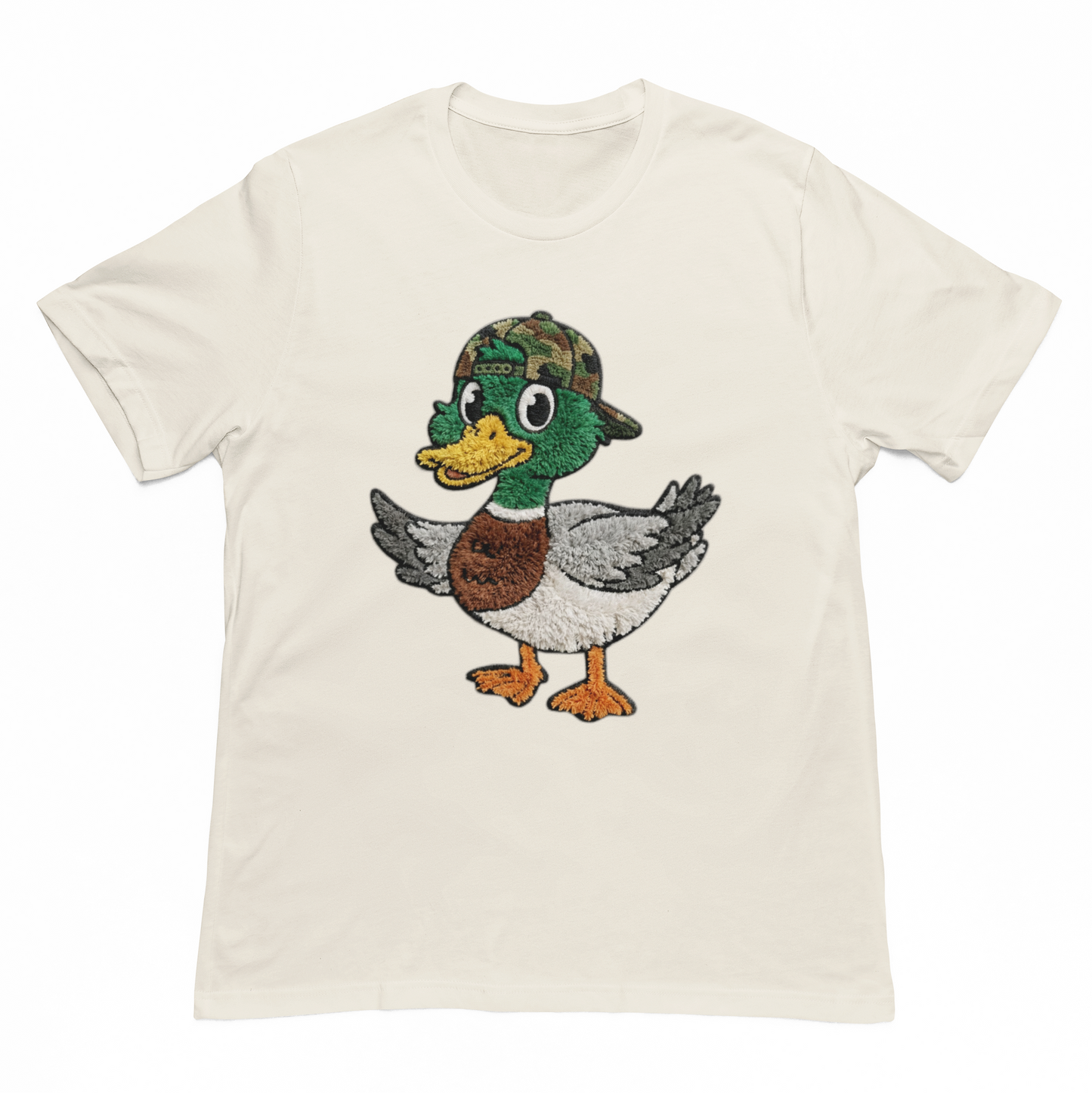 Beige t-shirt with a cartoon duck graphic on a white background