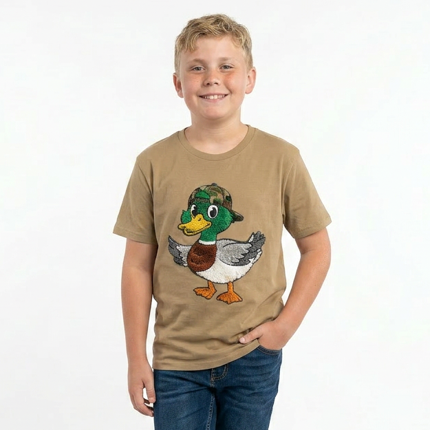 Child wearing a beige t-shirt with a duck graphic on a white background