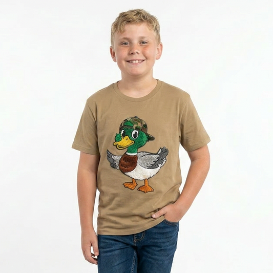 Child wearing a beige t-shirt with a duck graphic on a white background