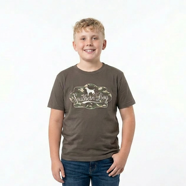 Young boy wearing a brown t-shirt with a logo and blue jeans on a white background