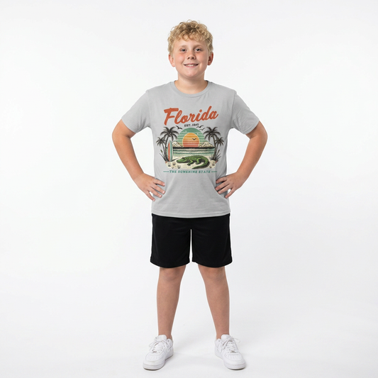 Child wearing a gray 'Florida' t-shirt with a graphic design on a white background