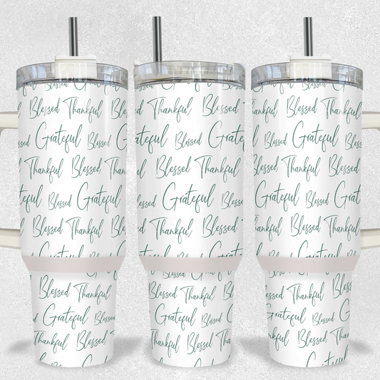 "40oz white inspirational tumbler with elegant green script repeating the words 'Blessed, Thankful, Grateful,' comes with handle, lid, and straw."