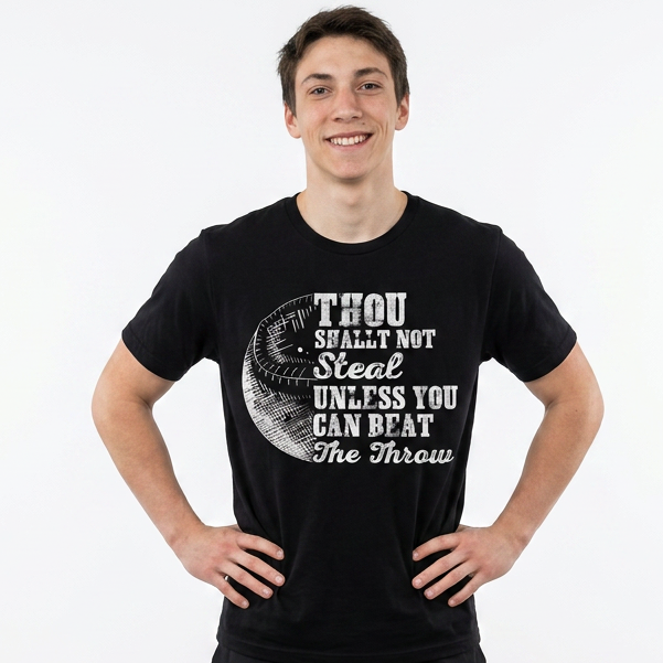 Person wearing a black t-shirt with white text on a white background