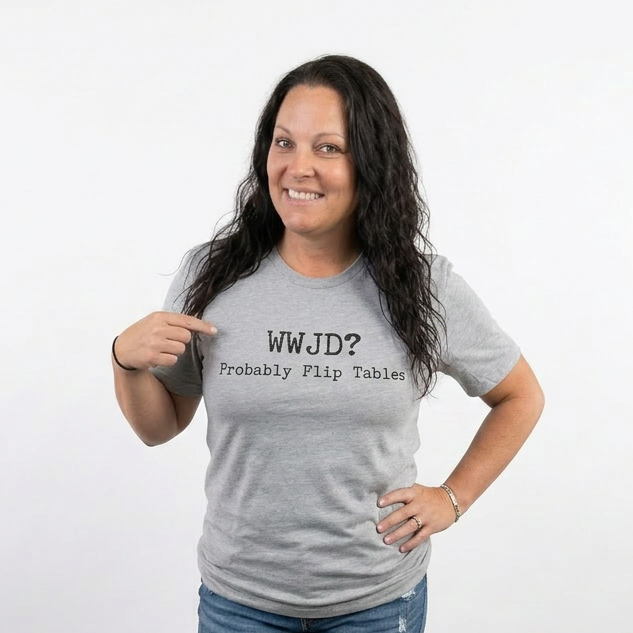 Woman wearing a gray t-shirt with text, standing against a white background