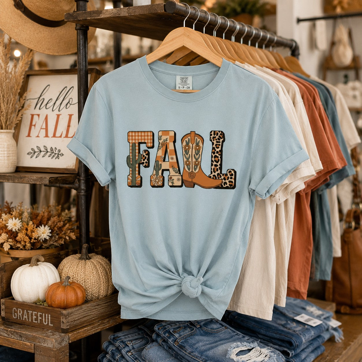 Tea-Shirt Shoppe light blue Comfort Colors 1717 graphic t-shirt featuring a fall-themed cowboy boot design