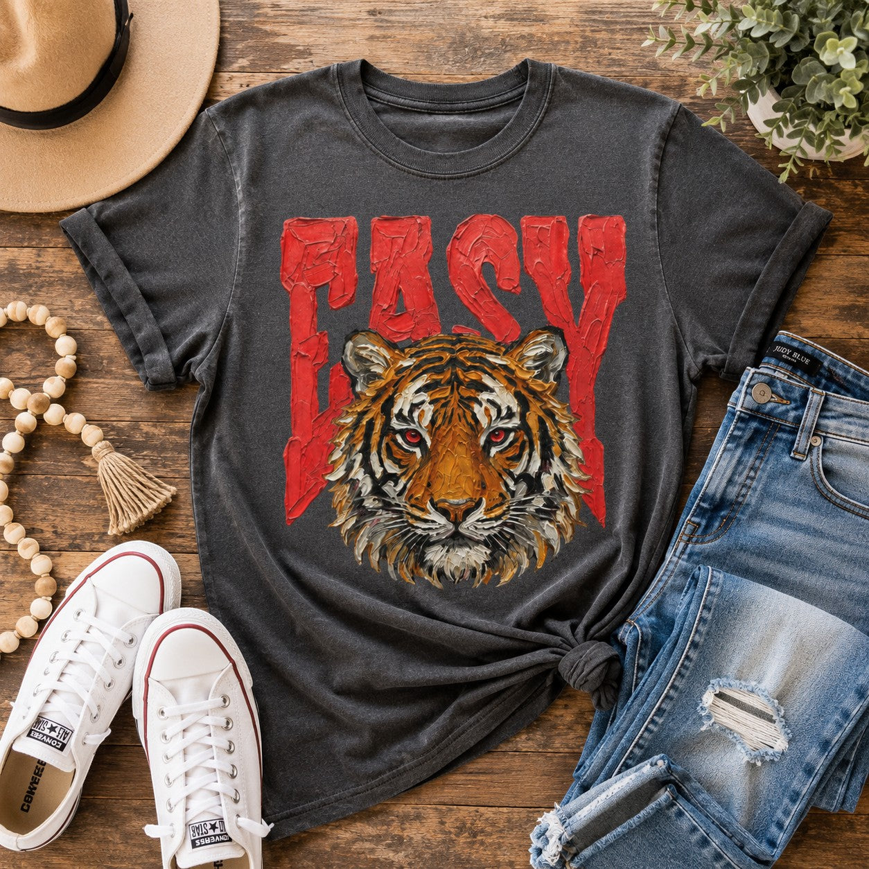 Tea-Shirt Shoppe faded black heavy weight graphic tee featuring a painted tiger and red Easy text on a wooden surface