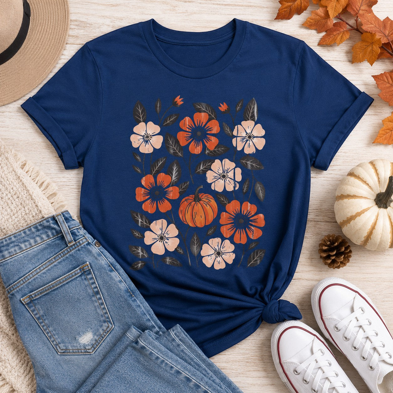 Tea-Shirt Shoppe navy blue adult graphic tee featuring a floral and pumpkin autumn print with rolled sleeves.