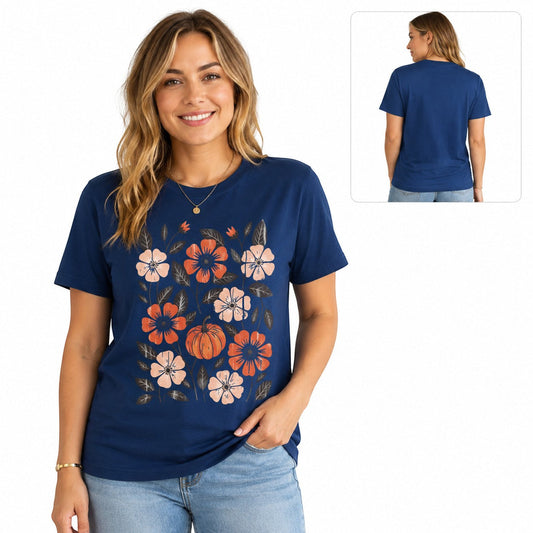 Tea-Shirt Shoppe navy blue graphic tee featuring a floral and pumpkin print worn by a smiling woman