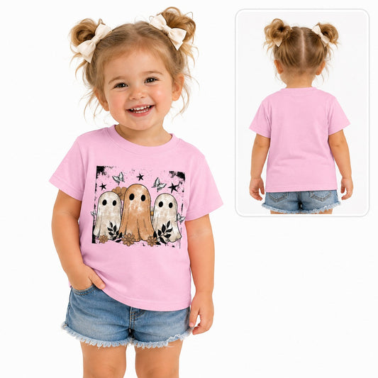 Toddler girl wearing a Tea-Shirt Shoppe pink graphic tee featuring vintage ghosts, flowers, and stars.