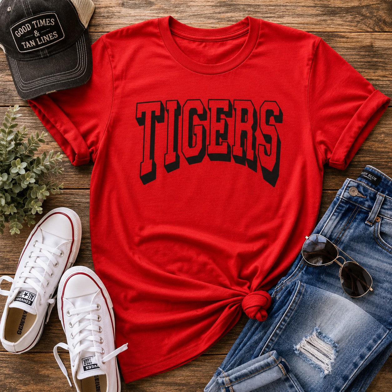 Tea-Shirt Shoppe red Gildan 3000 graphic tee with black Tigers text, styled with sneakers, jeans, and a baseball cap.