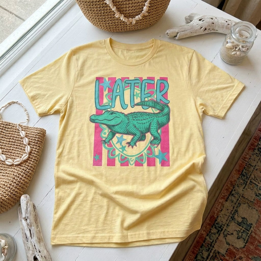 Tea Shirt Shoppe Wholesale yellow 100% cotton graphic tee with a green alligator and "Lator" text.