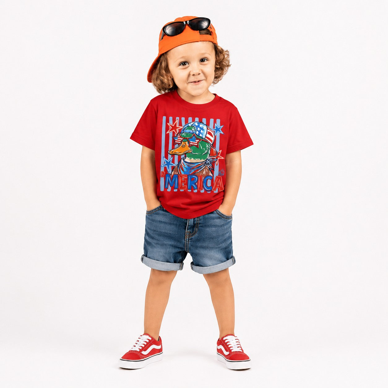 Tea Shirt Shoppe Wholesale red 100% cotton graphic tee with an American flag-themed duck wearing sunglasses and "AMERICA" text.