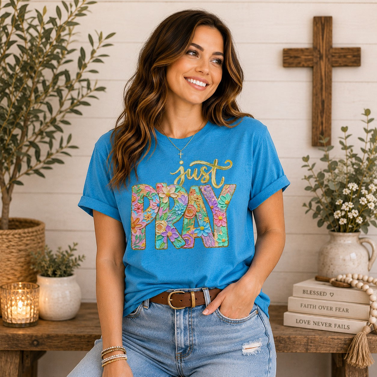 Tea Shirt Shoppe Wholesale blue 100% cotton graphic tee with "just PRAY" in colorful floral letters.