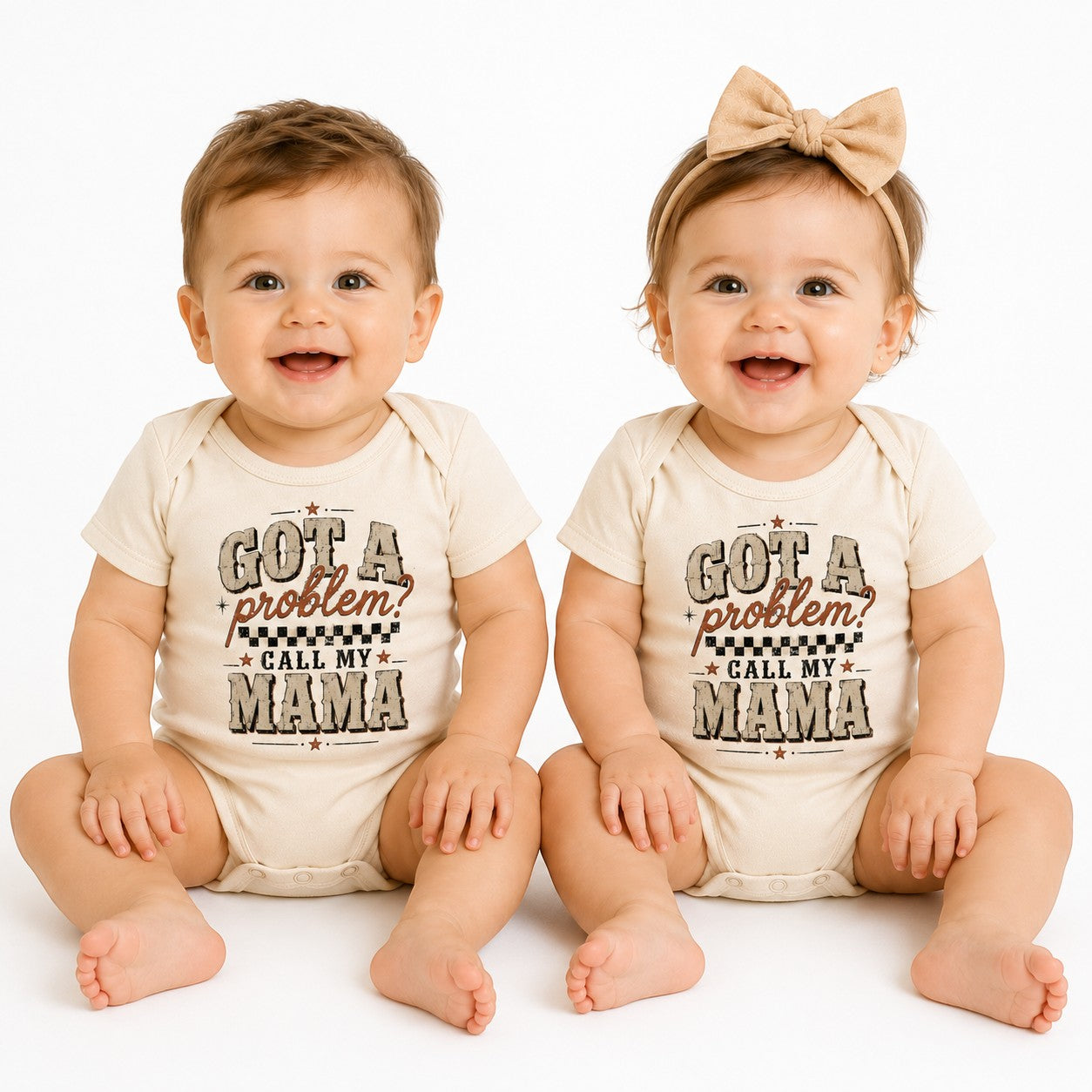 Two babies wearing Tea Shirt Shoppe Wholesale cream infant bodysuits with Got a Problem Call My Mama graphic print.