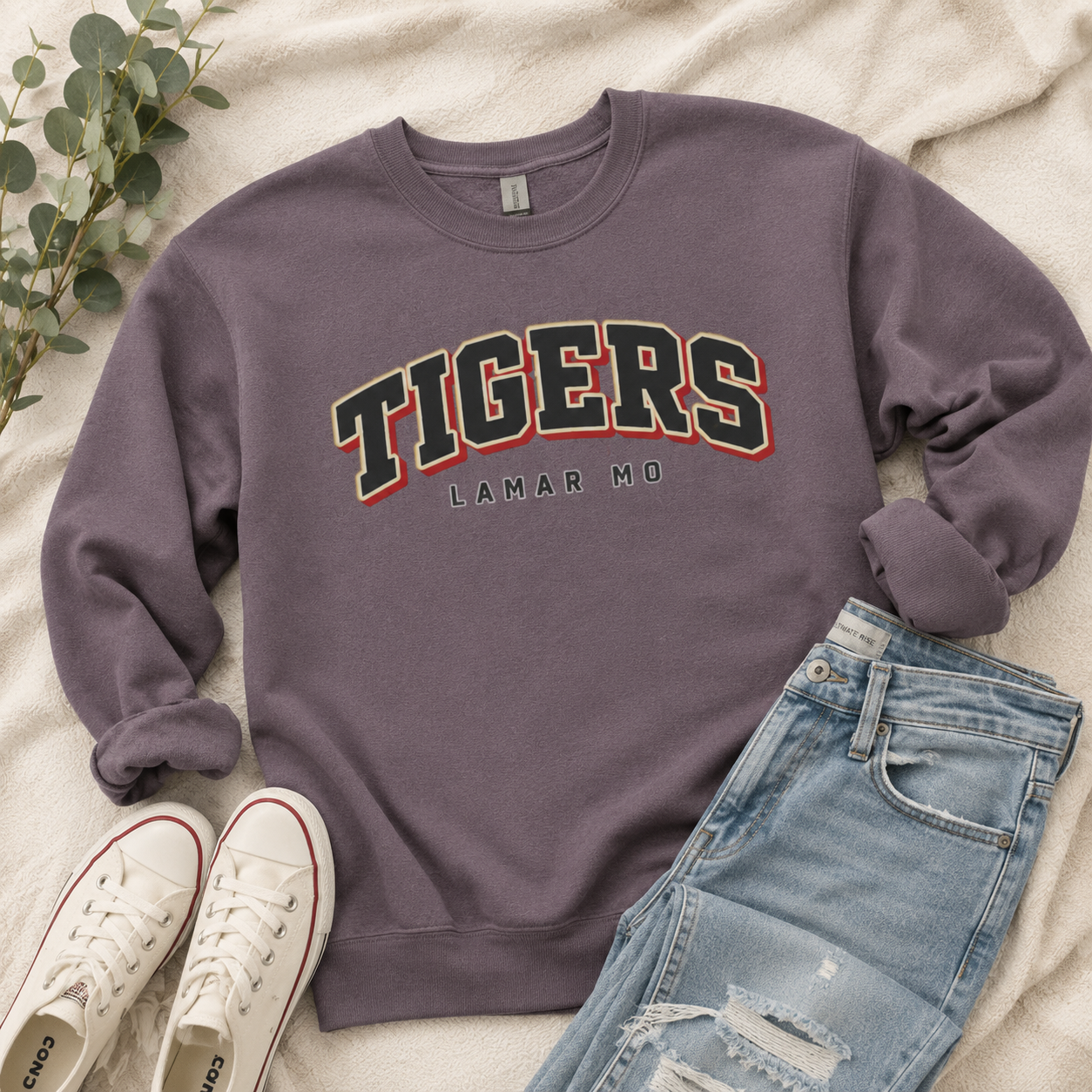 Tea Shirt Shoppe Wholesale charcoal grey custom varsity sweatshirt with Tigers Lamar MO graphic on a cozy blanket.