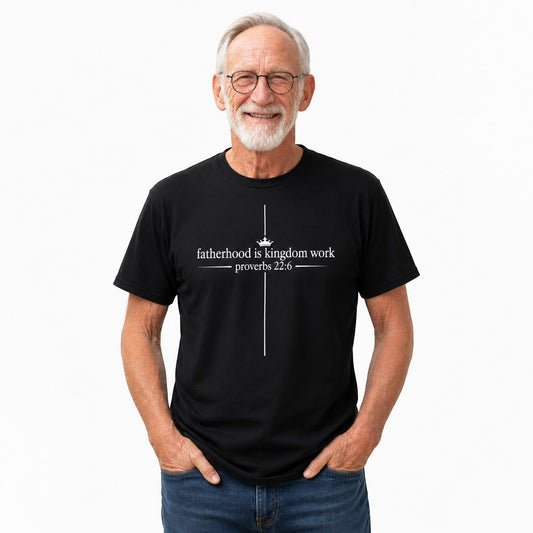 Tea Shirt Shoppe Wholesale black graphic tee with "fatherhood is kingdom work proverbs 22:6" and a crown above a cross.