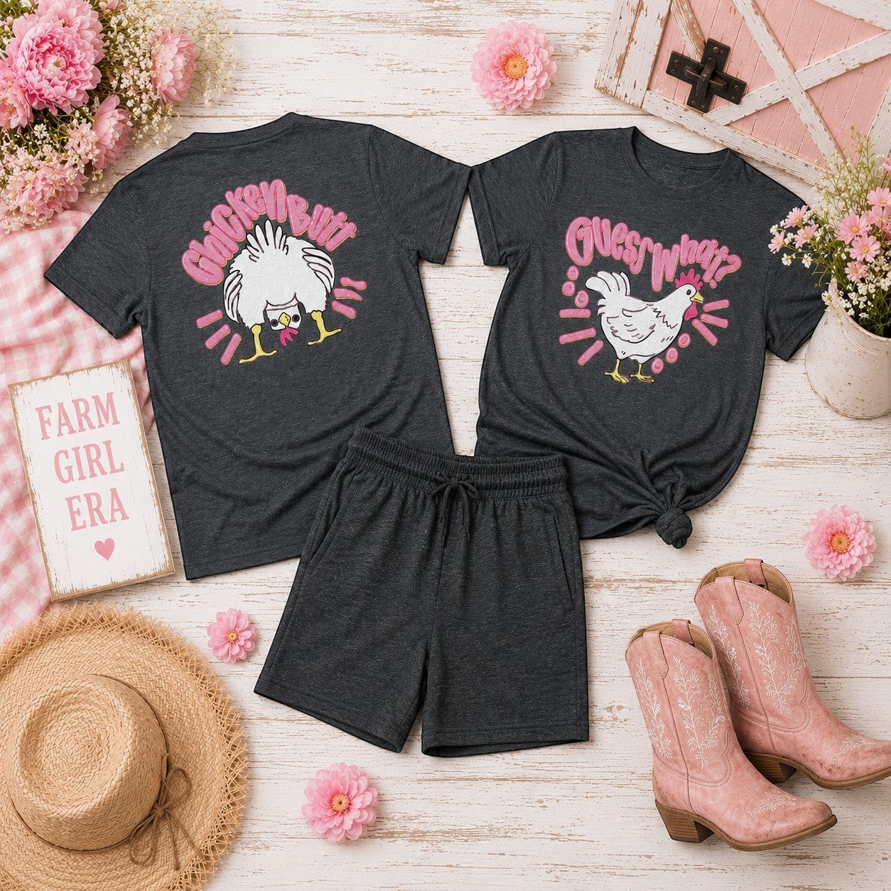 Tea Shirt Shoppe Wholesale dark grey 100% cotton graphic tee with a white chicken and pink text saying Guess What? DTF print.