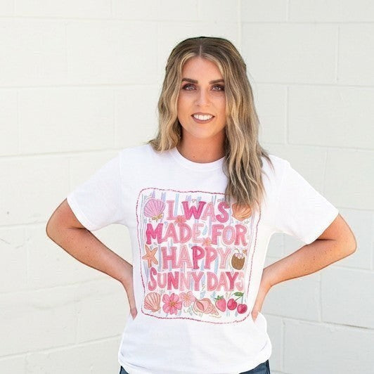 Tea Shirt Shoppe Wholesale white 100% cotton graphic tee with "I Was Made For Happy Sunny Days" DTF print, featuring shells, flowers, and fruit.