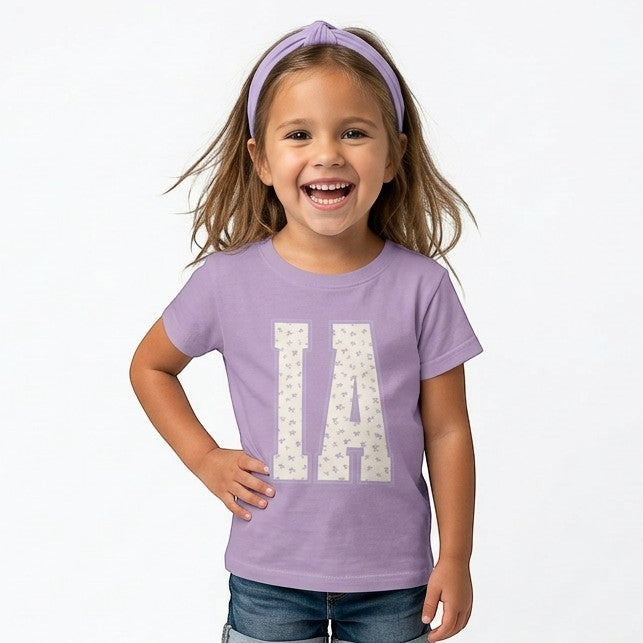 Tea Shirt Shoppe Wholesale lavender cotton t-shirt with "IA" floral graphic for youth and toddlers.