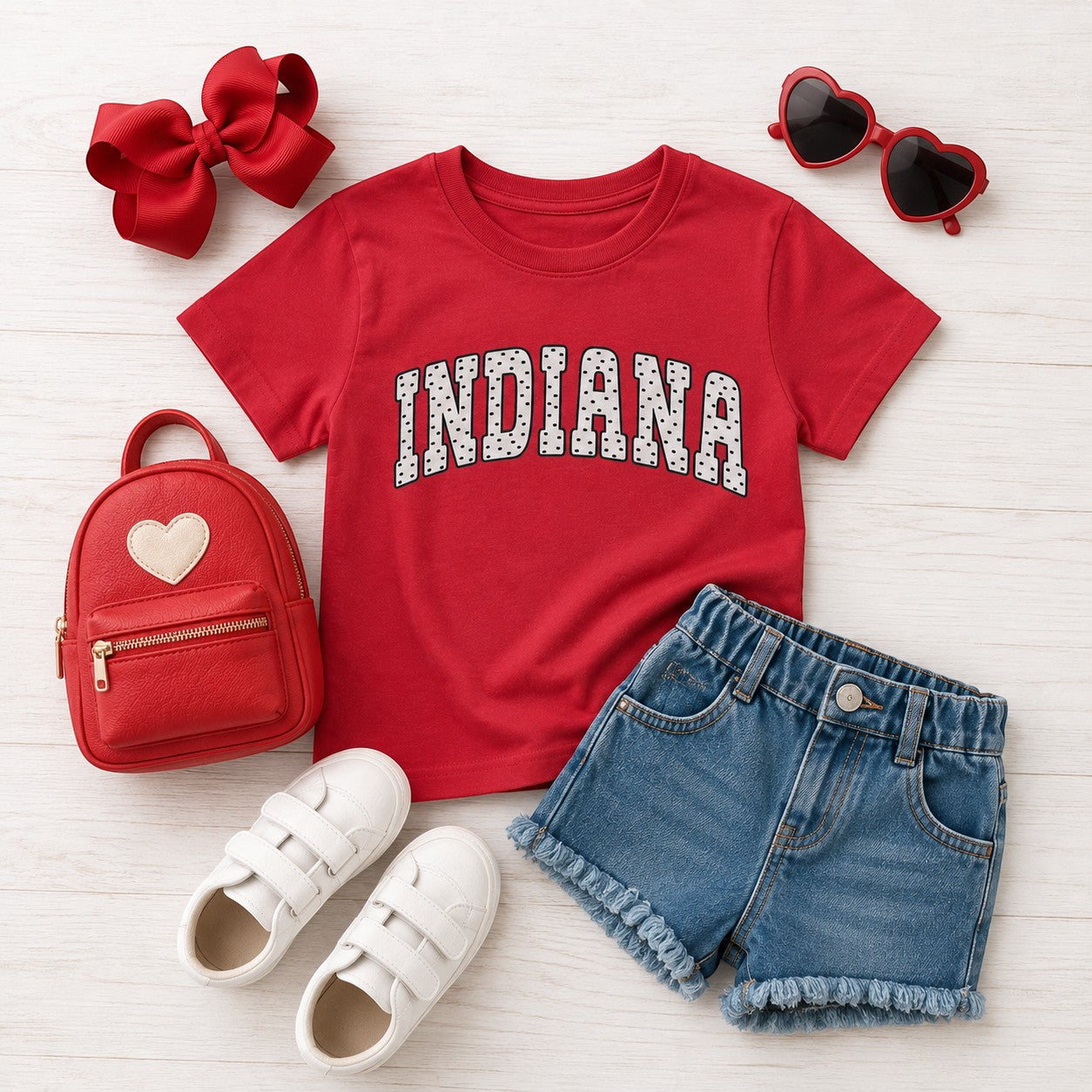 Tea Shirt Shoppe Wholesale red Indiana collegiate graphic t-shirt with polka dot lettering, styled with accessories.