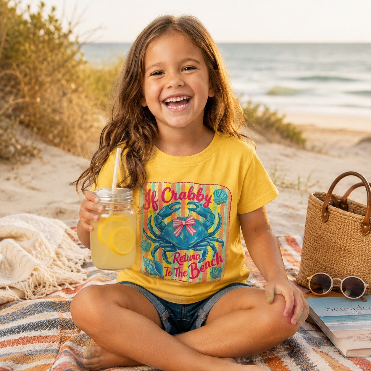 Tea Shirt Shoppe Wholesale yellow t-shirt with blue crab graphic and pink bow, text reads "If Crabby Return To The Beach".