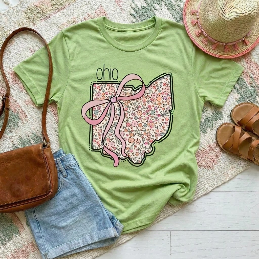 Tea Shirt Shoppe Wholesale mint green graphic tee with floral Ohio outline and pink bow. 100% cotton.