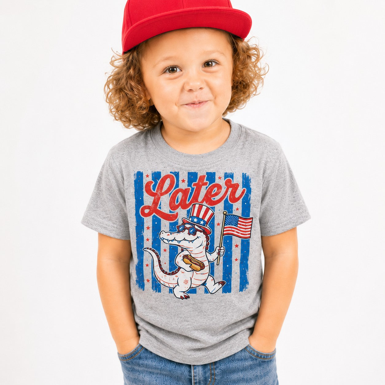 Tea Shirt Shoppe Wholesale heather grey youth graphic tee with alligator in Uncle Sam hat holding American flag.