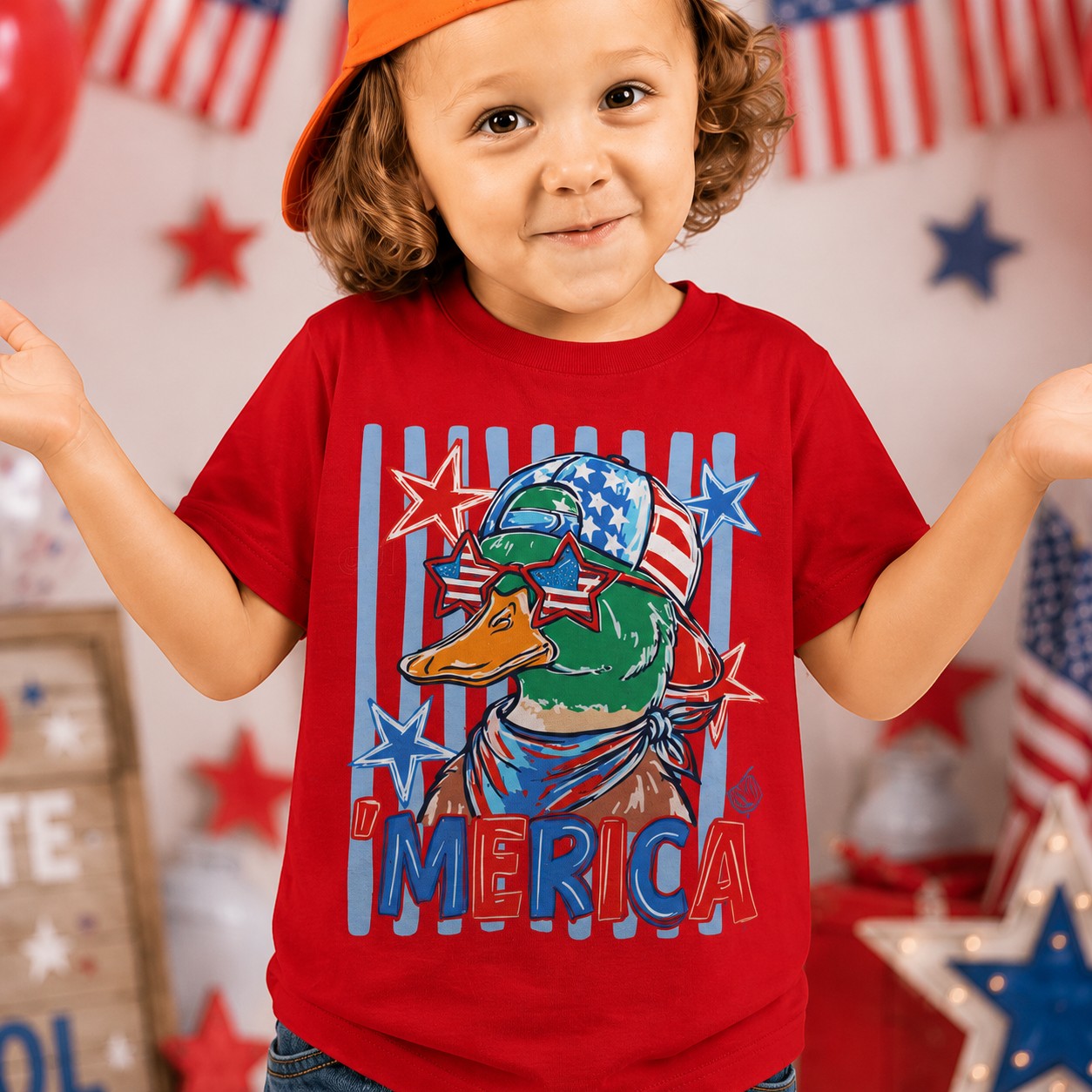 Tea Shirt Shoppe Wholesale red 100% cotton graphic tee with a duck wearing sunglasses and a bandana, "AMERICA" text.