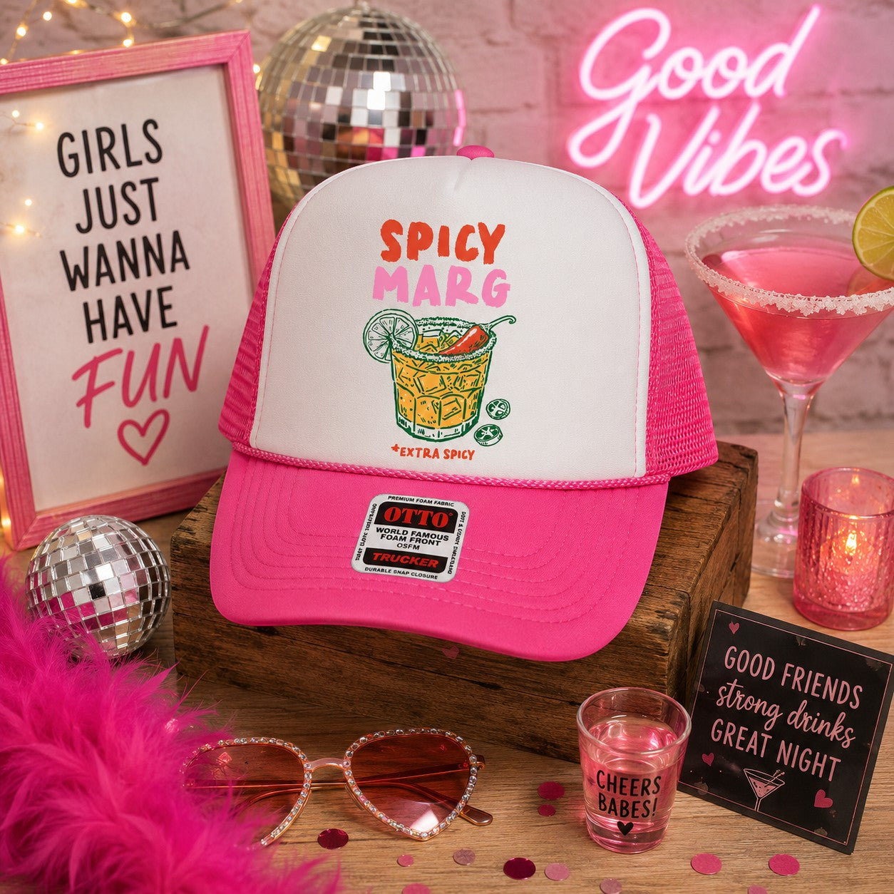 Tea Shirt Shoppe Wholesale Spicey Marg trucker hat with white front panel and pink brim and mesh back. Features a graphic of a margarita cocktail.