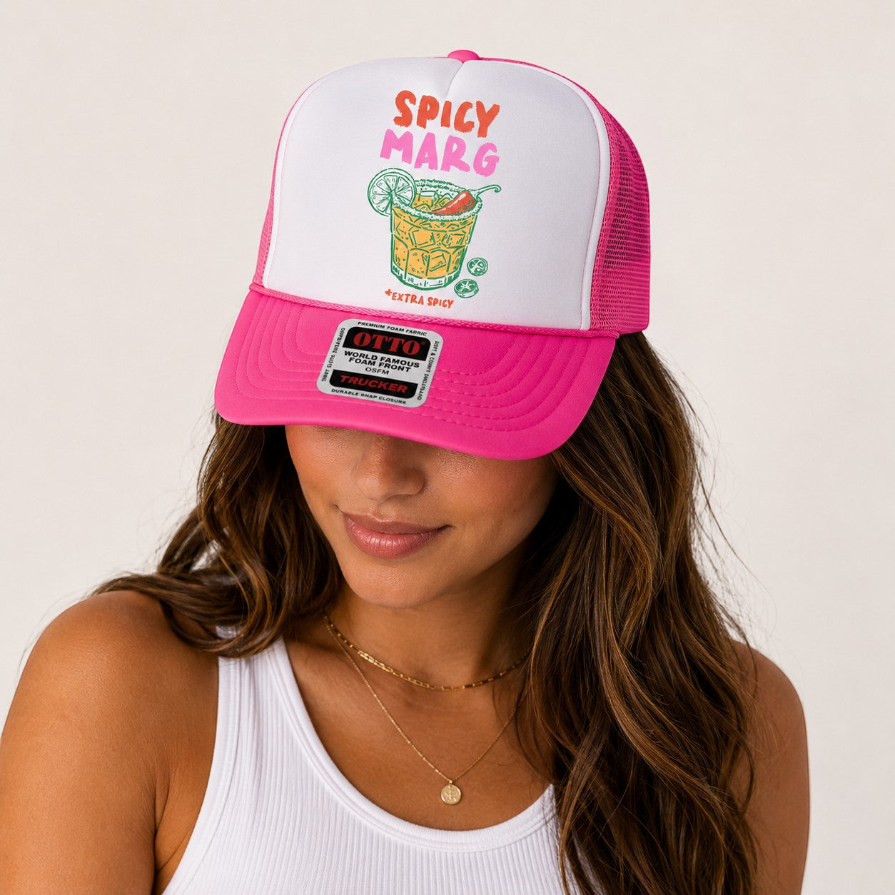 Tea Shirt Shoppe Wholesale Spicey Marg trucker hat with white front panel, pink mesh back, and graphic of a margarita.