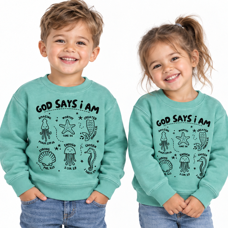Tea Shirt Shoppe Wholesale toddler sweatshirts in teal with ocean creature illustrations and faith-based scripture text