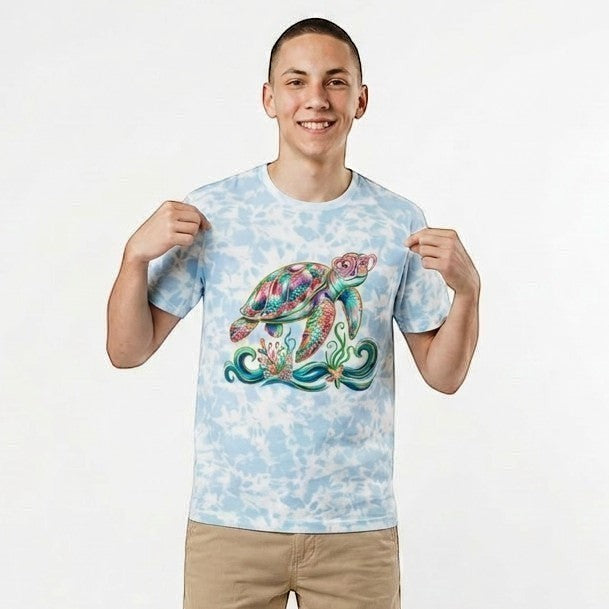 Tea Shirt Shoppe Wholesale light blue tie-dye 100% cotton t-shirt with a colorful sea turtle graphic and ocean details.