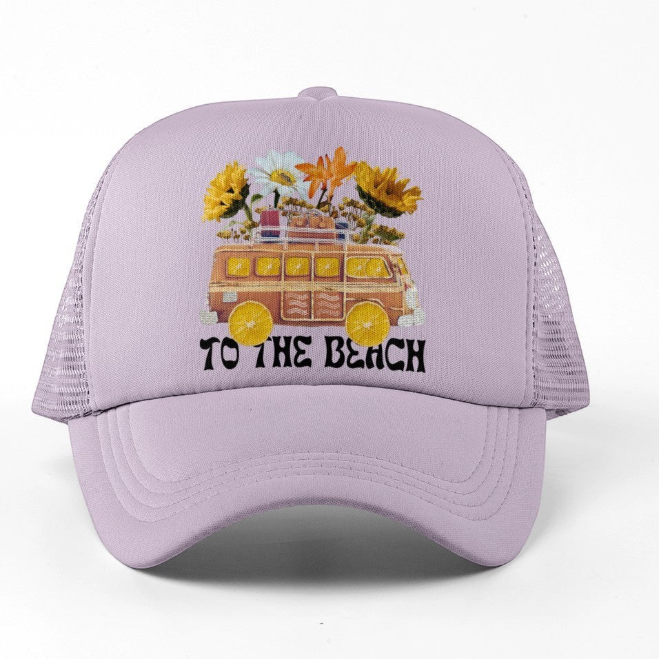 Tea Shirt Shoppe Wholesale light purple trucker hat with embroidered retro van, flowers, and "To The Beach" text.